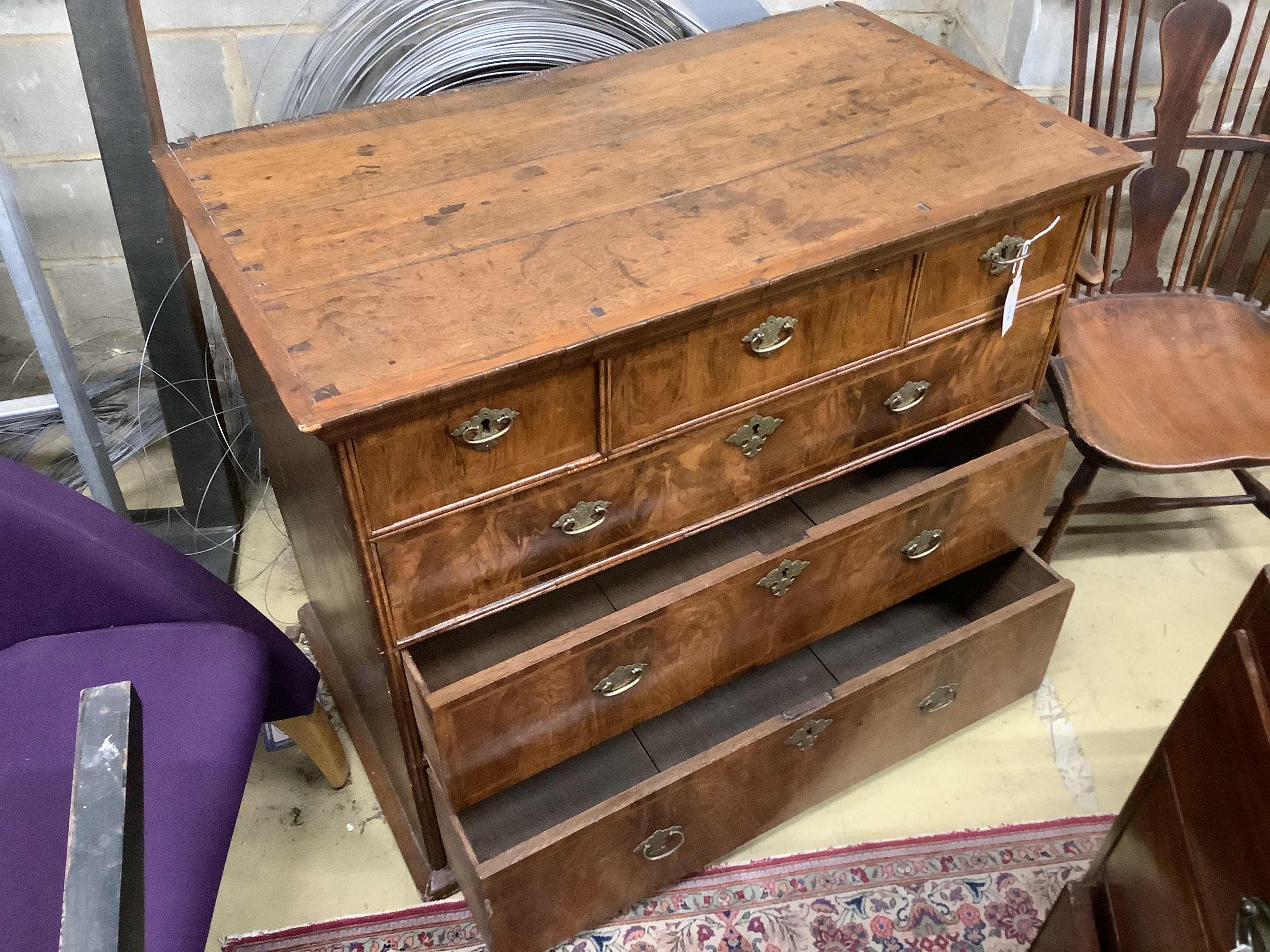 The upper part of a walnut chest on chest, 18th century